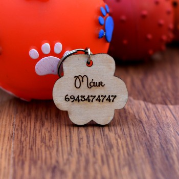 Wooden ID card for dog or cat with engraving in the shape of a paw 